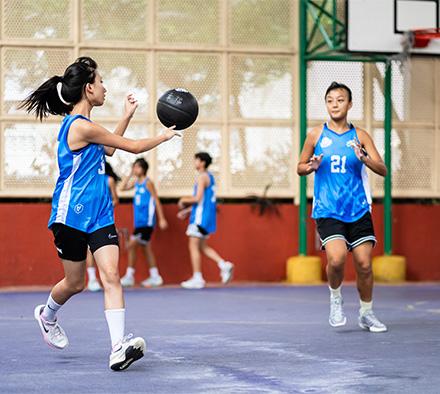 Girls from Fortune Warriors a team sponsored by Goodman Hong Kong playing basketball